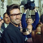 FILE - In this Monday, Oct. 18, 1993, file photo, pop star George Michael, 30, outside the Royal Courts of Justice in London at the start of his court action against Sony Music Entertainment (UK) Ltd. Michael, who rocketed to stardom with WHAM! and went on to enjoy a long and celebrated solo career lined with controversies, has died, his publicist said Sunday, Dec. 25, 2016. He was 53. (ANSA/AP Photo/Alistair Grant, File) [CopyrightNotice: AP1993]