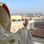 In this photo released by the Vatican's L'Osservatore Romano newspaper,  Pope Benedict XVI delivers his blessing to the faithful gathered in St. Peter's Square at the Vatican, from the velvet-draped loggia of St. Peter's Basilica, during the "Urbi et Orbi" message, Latin for ''to the city and to the world", Tuesday, Dec. 25, 2007. The pontiff issued a Christmas Day appeal  to political leaders around the globe to find the "wisdom and courage'' to end bloody conflicts in Darfur, Iraq, Afghanistan and the Congo. (AP Photo/L'Osservatore Romano, HO)