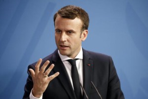 epa05966656 French President Emmanuel Macron speaks as German Chancellor Angela Merkel (not pictured) attend a joint press conference at the German Chancellery in Berlin, Germany, 15 May 2017. The French President makes his inaugural foreign visit to Germany.  EPA/CARSTEN KOALL
