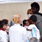 Migrants are rescued after landing from the ship 'Diciotti' of Coast Guard with 900 migrants in Catania, Italy, 13 June 2018.  ANSA/ORIETTA SCARDINO