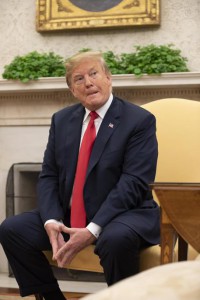 epa06845574 US President Donald J. Trump  listens to a reporter ask a question as he meets with President of Portugal Marcelo Rebelo de Sousa (out of frame) in the Oval Office at the White House in Washington, DC, USA,  27 June 27, 2018.  EPA/ALEX EDELMAN / POOL