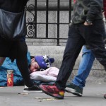 epaselect epa07071474 Pedestrians walk by a rough sleeper in London, Britain, 05 October 2018. Homeless figures are rising year on year figures have show. In London figures rose by 18 per cent from last year.  EPA/ANDY RAIN