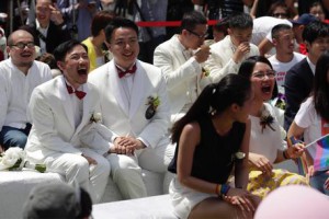 epa07596038 Same-sex married couples react during the first day of civil registration for same-sex marriage in Taipei, Taiwan, 24 May 2019. Taiwan became the first Asian country to legalize same-sex marriage after a bill was passed on the 17 May 2019. Hundreds of gay and lesbian couples have applied to register for a legal union on the day the bill is to come into effect.  EPA/RITCHIE B. TONGO